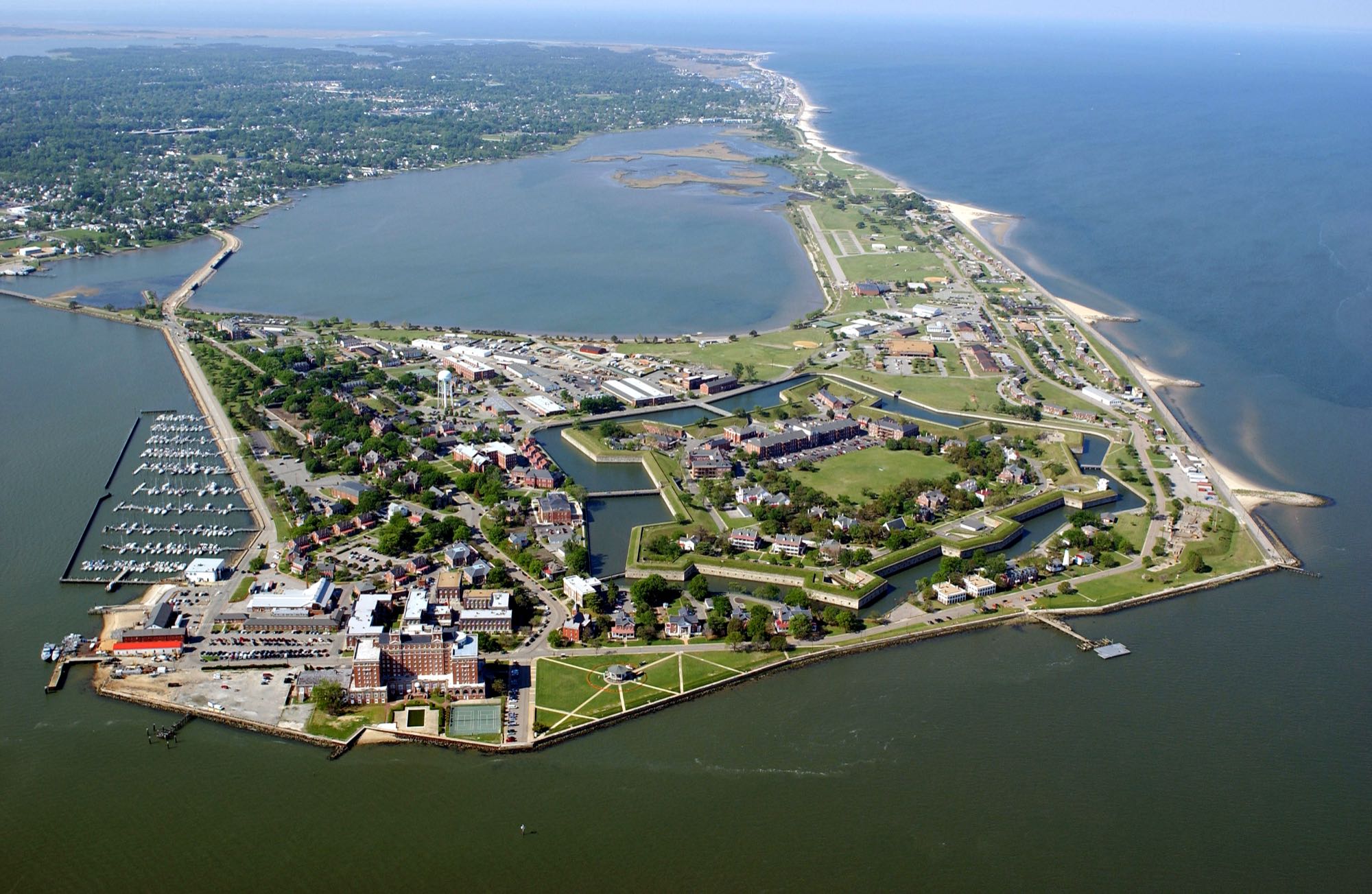 Aerial view of the star-shaped Fort Monroe at Old Point Comfort, with the marina and Chesapeake Bay